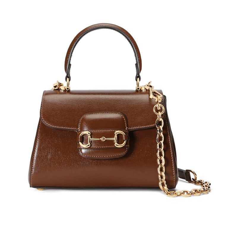 Gucci - The Gucci Horsebit 1955 shoulder bag, a mainstay of the House  handbag collections with its defining hardware, is introduced in a new soft  yet structured shape reminiscent of a camera