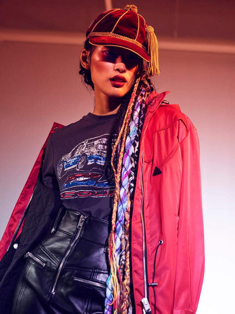 Polyamide jacket, cotton T-shirt with sequins, and leather miniskirt, Coach. Wool cap, Gucci 